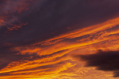 Low angle view of dramatic sky during sunset