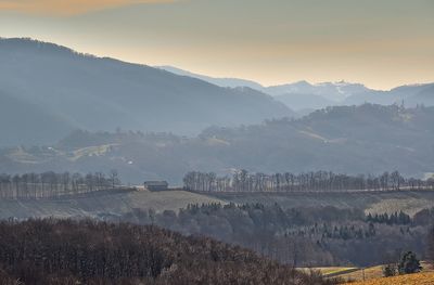 Scenic view of landscape and mountains against sky