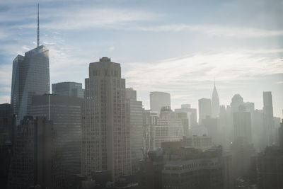 Modern buildings in city against sky