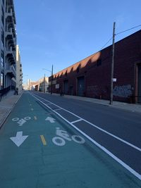 Road by building against sky in redhook, brooklyn 