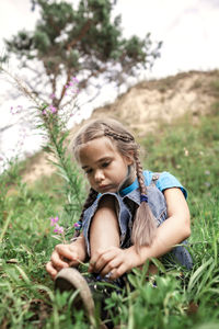 Girl looking away on field