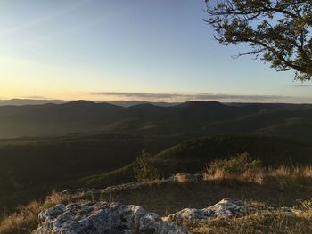 Scenic view of landscape against sky during sunset