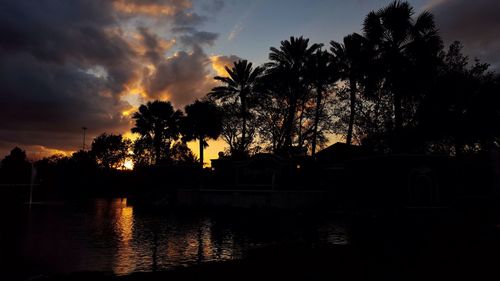 Scenic view of river at sunset