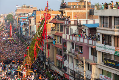 Devotees pull chariots as they take part in the festivities to mark the rato machindranath chariot.