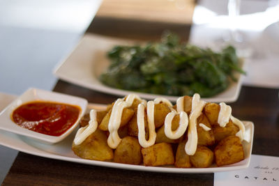 Close-up of serving food on table