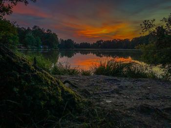 Scenic view of lake against sky during sunset