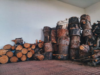 Stack of firewood on against wall