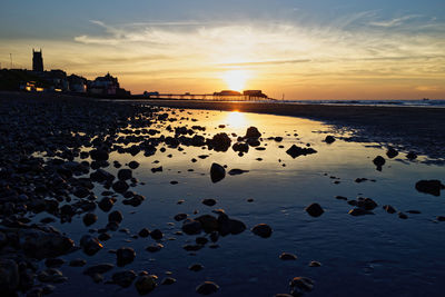 Scenic view of sea against sky during sunset