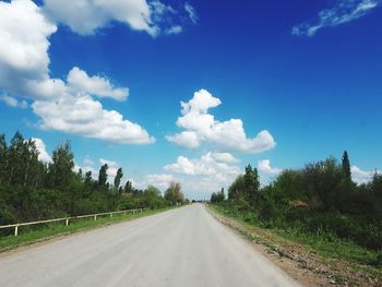 Empty road along countryside landscape