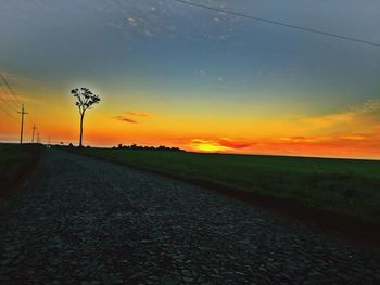 Empty road at sunset