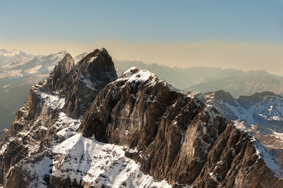 Scenic view of mountains against sky during winter