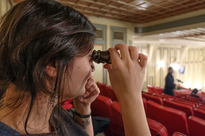 Portrait of woman photographing