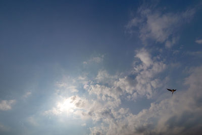 Low angle view of airplane flying in sky