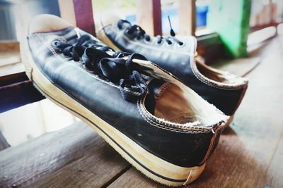 Close-up of shoes on hardwood floor