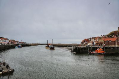 Panoramic view of sea against sky in city