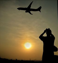 Silhouette of people at sunset