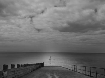 Pier over sea against sky