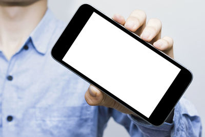 Low angle view of person using smart phone