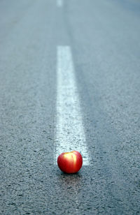 Close-up of apples on road