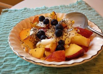 Close-up of healthy fruit breakfast served in plate on table