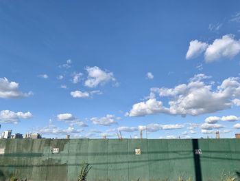 Low angle view of buildings against blue sky