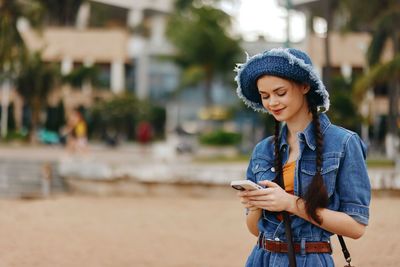 Young woman using mobile phone