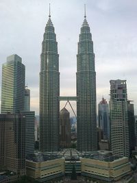 Modern buildings in city against sky