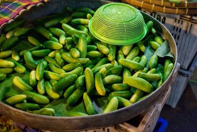 High angle view of fresh ivy gourd at market stall