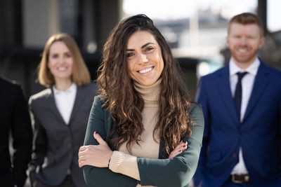 Portrait of business colleagues standing in office