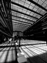 People walking on railroad station platform