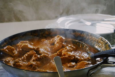 Close-up of chicken gravy in skillet pan