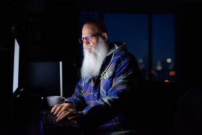 Man sitting on table at home