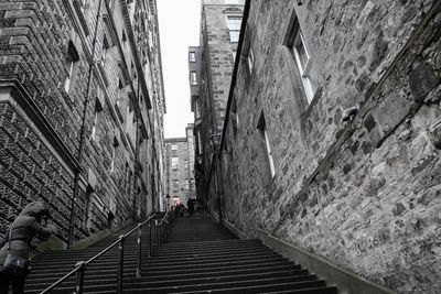 Narrow alley amidst buildings in city