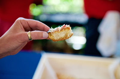 Cropped hand holding appetizer toast