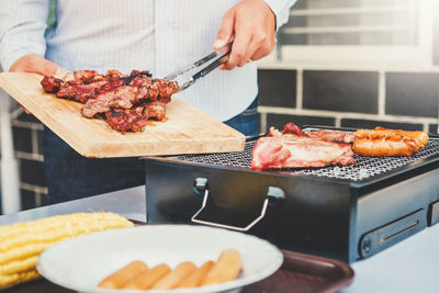Man preparing food on cutting board
