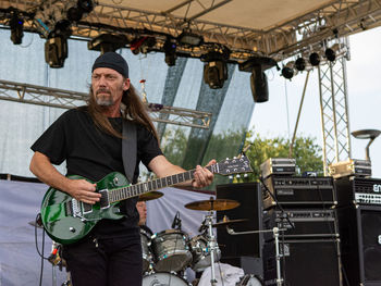 Portrait of a man playing guitar