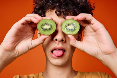 Close-up of woman holding fruits