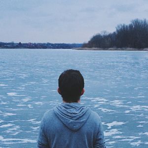 Rear view of a man in water