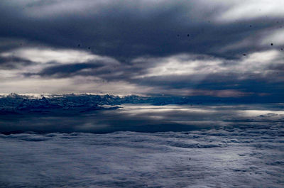 Close-up of snow on landscape against sky