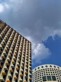 Low angle view of modern building against sky