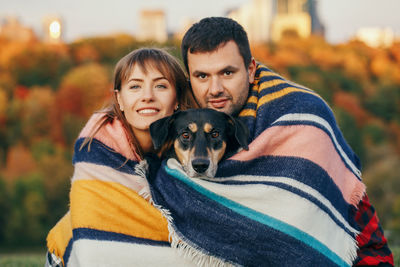 Portrait of couple with dog