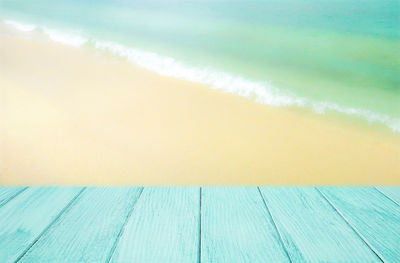 Close-up of sea shore against sky