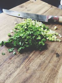 Close-up of chopped spring onion on cutting board