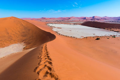 Scenic view of desert against clear sky