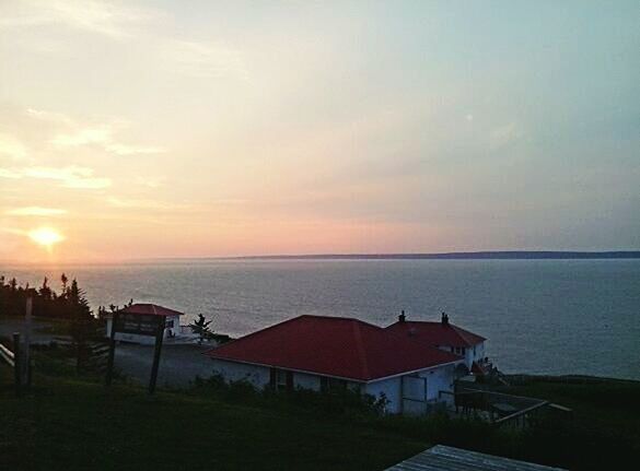 SCENIC VIEW OF SEA AGAINST SUNSET SKY