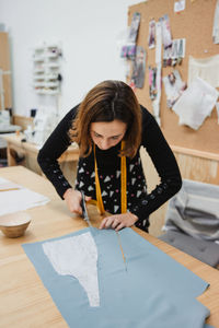 Woman sitting on table