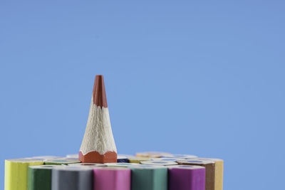 Close-up of colored pencils against blue background 