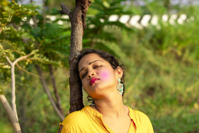 Portrait of beautiful young woman looking away