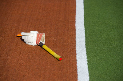 High angle view of glove on sports field