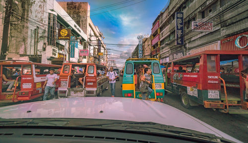 Cars on road against sky